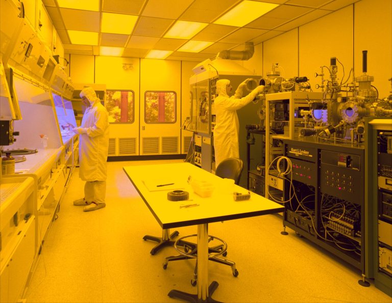 Two New Chip Factories for Malta, New York in $21 Billion Japan Deal Semiconductor wafer being inspected inside a chip factory clean room